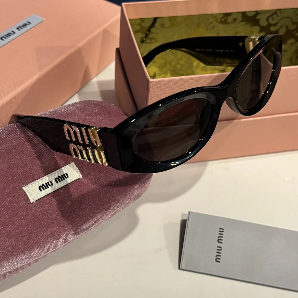 Miu Miu Gloss Black Oval Sunglasses 3D Gold Logo Temple